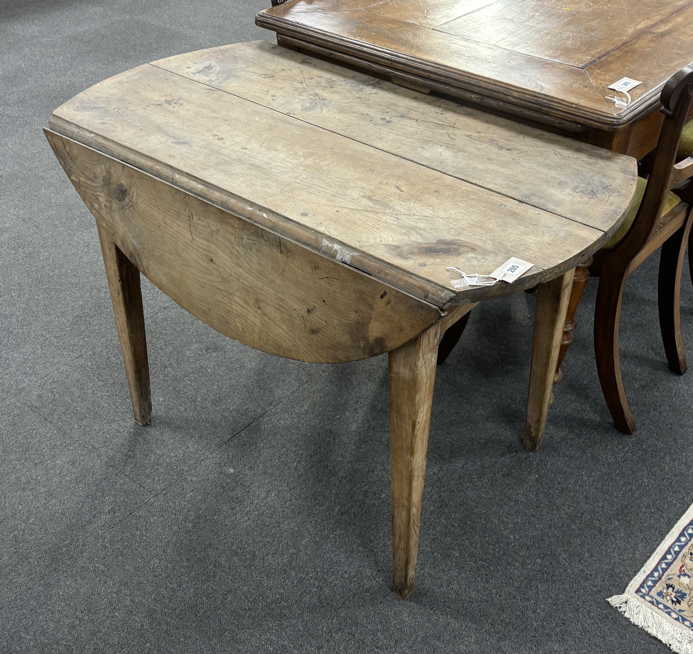 A 19th century French cherry drop leaf kitchen table, width 104cm, depth 58cm, height 72cm